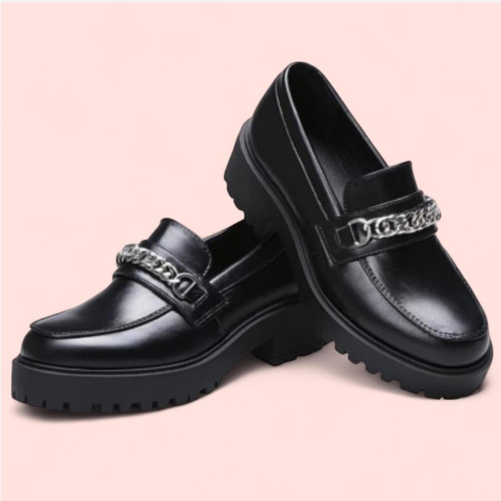 Black chunky loafers with silver chain detail